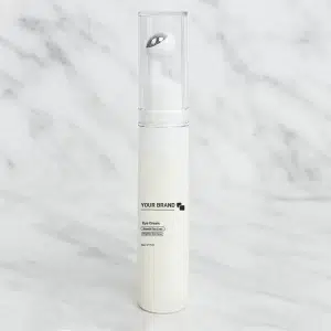 White eye cream bottle with a silver rollerball applicator, labeled 'Eye Cream' for smoothing fine lines and brightening eye area.