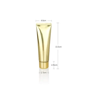 Golden cosmetic squeeze tube with a matching cap, 13.3cm tall, ideal for private label skincare formulations.